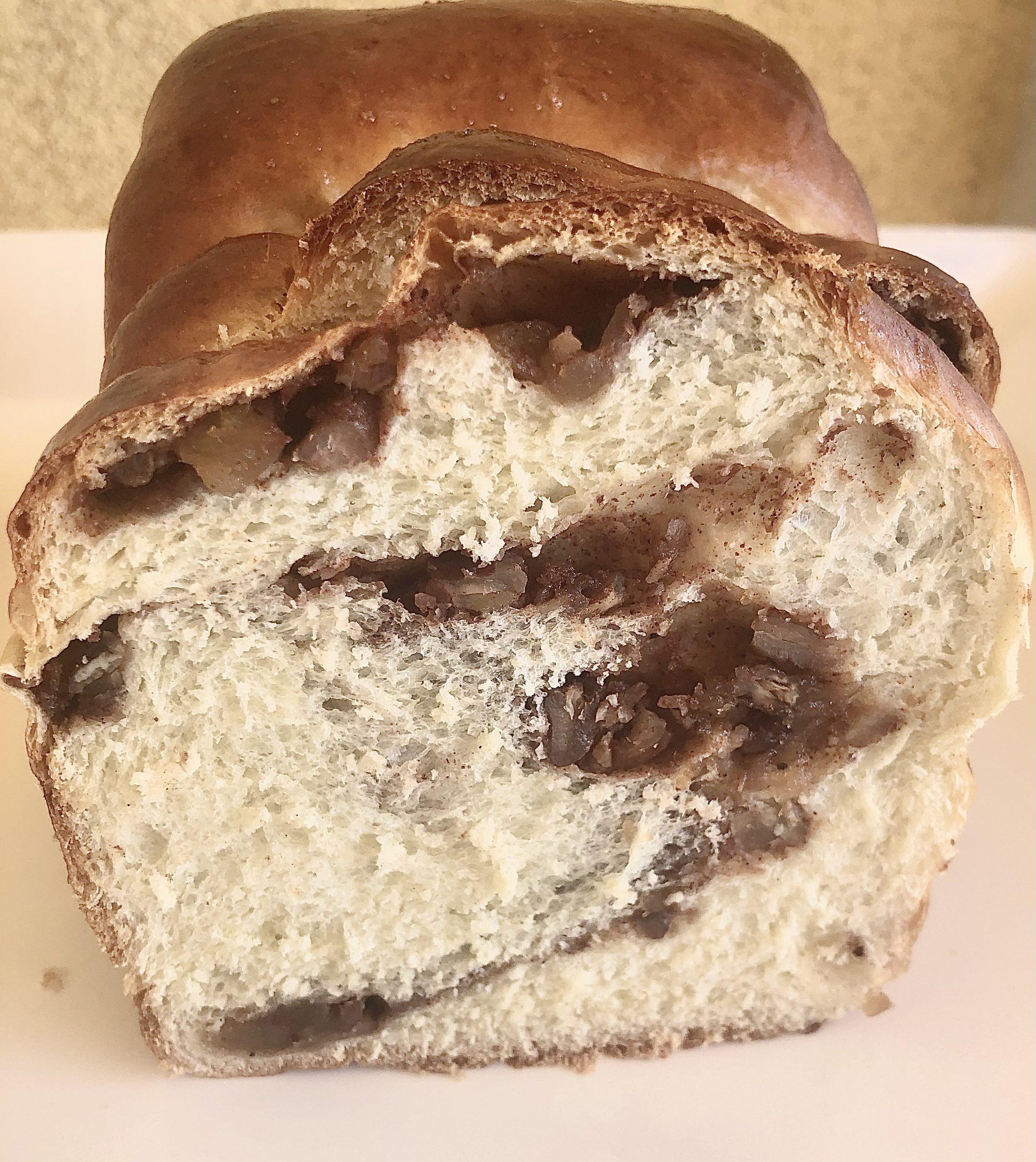 The crumb of a Cinnamon Swirl milk bread loaf, soft and airy with cinnamon filling.
