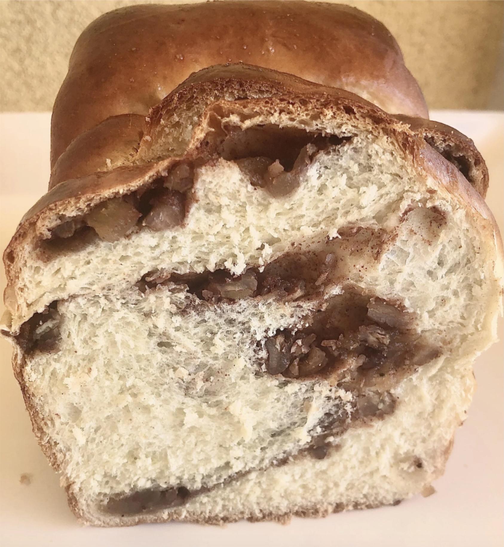 Sliced Apple Pie Milk Bread loaf with apples, pecans and cinnamon swirl