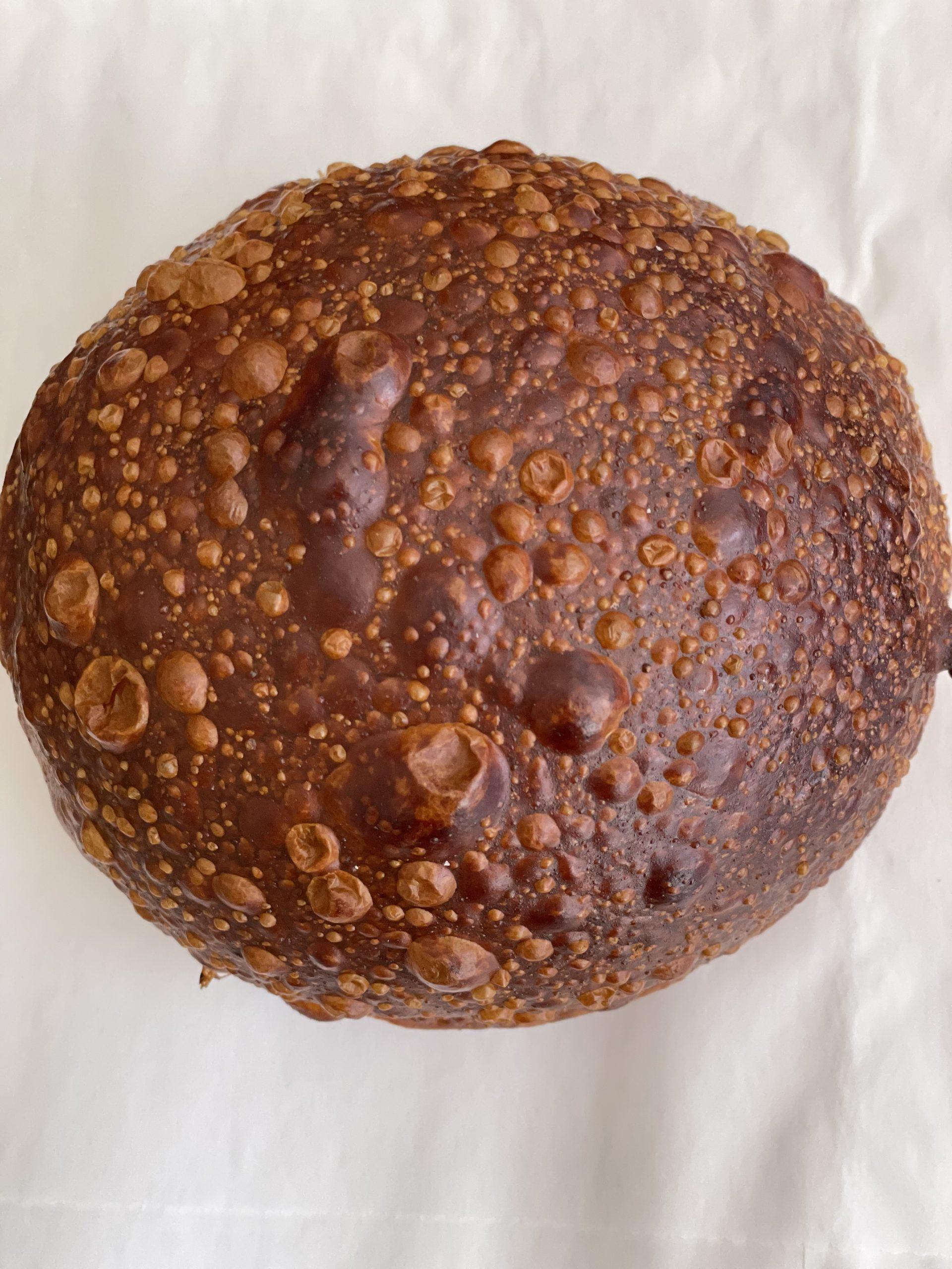 A golden milk bread pretzel roll from Billy Bread
